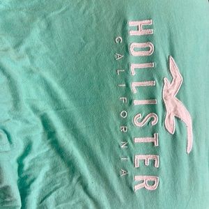 Teal Hollister shirt.